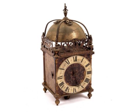 A 19th Century brass lantern type clock with bell to the strapwork top and pierced fretwork gallery, the engraved dial with s