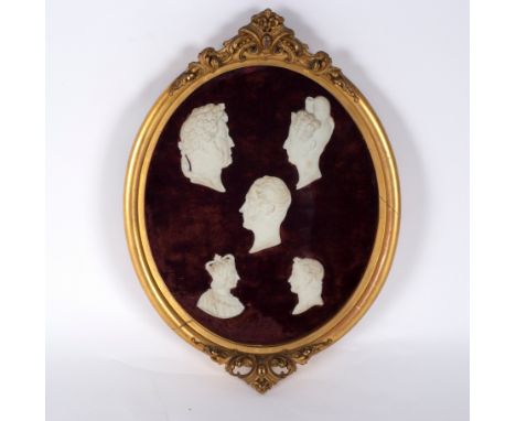 A group of five bisque profiles of historic figures, framed as one