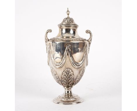 A George III silver sugar vase, William Abdy, London 1786, the acanthus chased lid with urn finial, with two scroll handles t