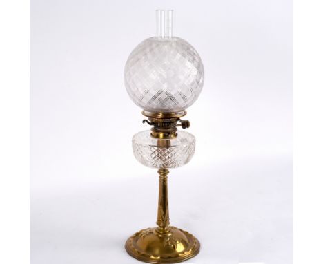 A brass and glass oil lamp with funnel, shade and reservoir in cut and moulded glass, 69cm high CONDITION REPORT: Funnel with