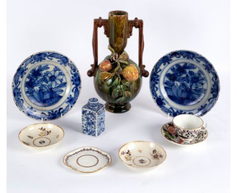 A Delft tea caddy with screw on lid, decorated panels of dragons and flowers, 11.5cm high, a pair of Delft plates and sundry 