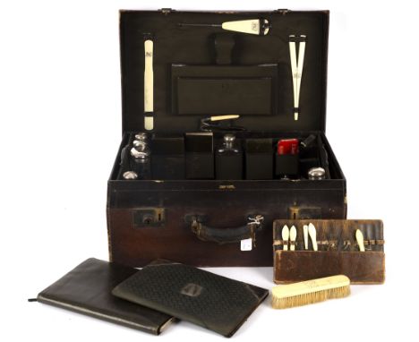 A Mappin &amp; Webb travelling vanity case part fitted with silver topped jars, bottles and flask (6), inkwells, leather jewe