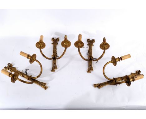 A set of four two-branch, two-light wall lights, each surmounted by a ribbon-tie and with reeded branches, 40cm high