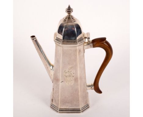 An early 18th Century style silver coffee pot, London 1907, of tapering square canted shape, crest and armorial to one side, 