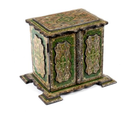 A Victorian papier-mâché and shell inlaid jewel chest, the panel doors enclosing four drawers with fitted lift-out trays, 21c