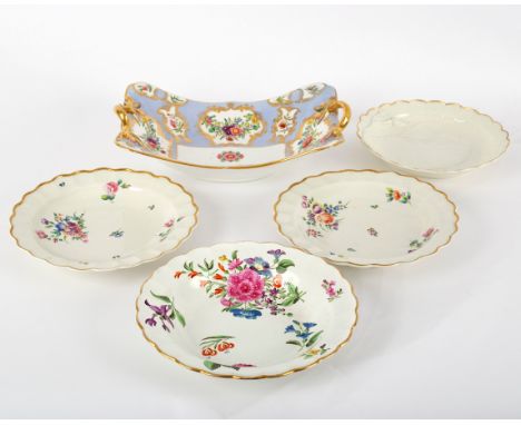 Two Worcester fluted circular plates, circa 1765-70, decorated with loose bouquets of flowers, 19cm diameter, together with a