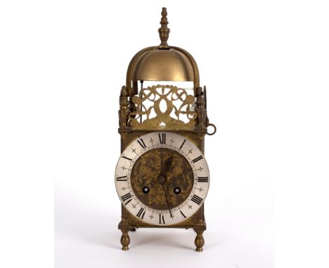 A 19th Century small lantern type mantel clock with pierced surround to the bell top, fitted a steel chapter ring and drum mo