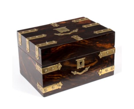 A Victorian coromandel and brass bound tea caddy, the cover with vacant shield cartouche, containing hinged lidded satinwood 