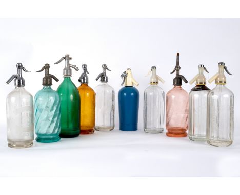 A quantity of glass soda water syphons CONDITION REPORT: Amber glass - Schweppes - Bruises and fractures to glass around edge