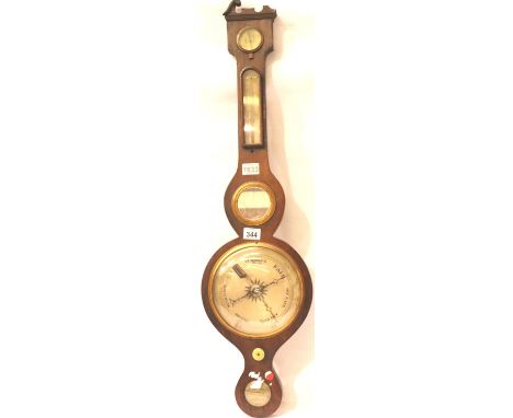 An Edwardian walnut framed aneroid barometer with thermometer, mirror and level, H: 93 cm. Not available for in-house P&amp;P