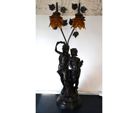 AFTER AUGUSTE MOREAU, a two&nbsp;branch table lamp, centred with two children talking a mount with a two branch lamp with lea