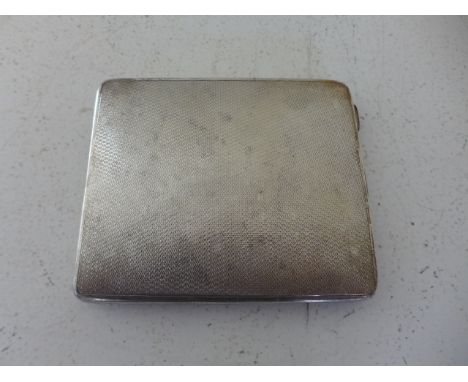 A silver hallmarked cigarette case, hallmark for Birmingham 1929-30 the exterior with engine turned finish, approx weight 3.8