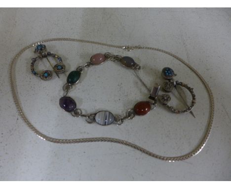 A silver and mixed stone bracelet together with two white metal, pearl and turquoise set Penannular brooches and a silver nec