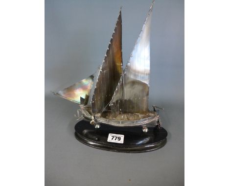 A model Maltese sailing boat in silver with Maltese hallmarks, set on a black wooden base - Height 27cm 