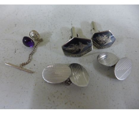 A silver and amethyst tie pin together with a pair of Siam Sterling silver cufflink's and another pair of silver cufflink's 