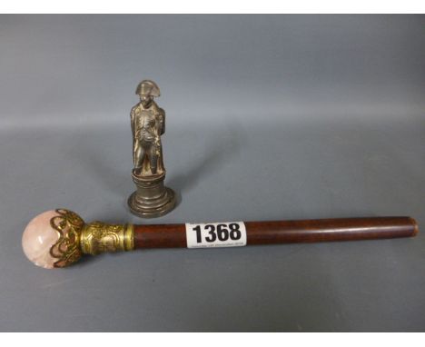 A rose quartz and gilt metal parasol handle bronzed metal model of Napoleon with imperial seal 