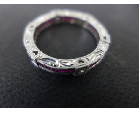 An 18ct white gold diamond and ruby eternity ring size M - approx weight 1.8 grams - good clean condition