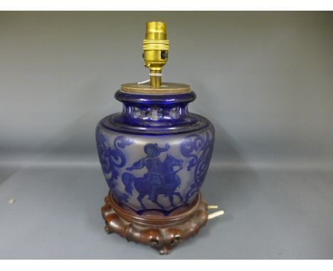 A Bristol blue glass lamp base with acid etched design to body displaying Hound, Huntsman and Stag with attacking hounds, all