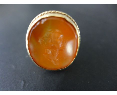 A 9ct yellow gold ring set with an Itaglio of Caesar - ring made by Andre March - ring size R - weight approx 10 grams - smal