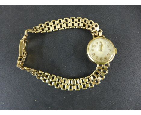 A ladies Tudor manual wind wristwatch in a Rolex 9ct yellow gold case and strap - not working - case and strap weight approx 