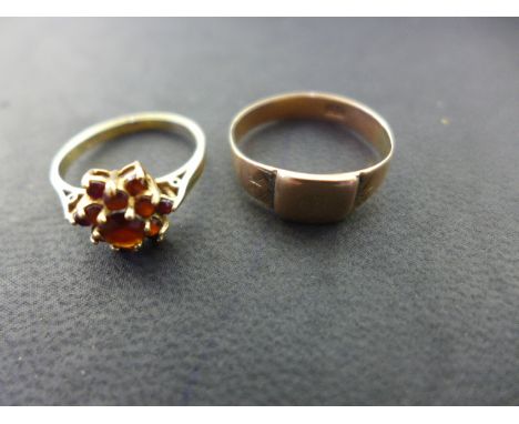 A 9ct gold and garnet cluster ring - size L and a 9ct gold signet ring - size N - Total weight approx. 4 gms Condition report