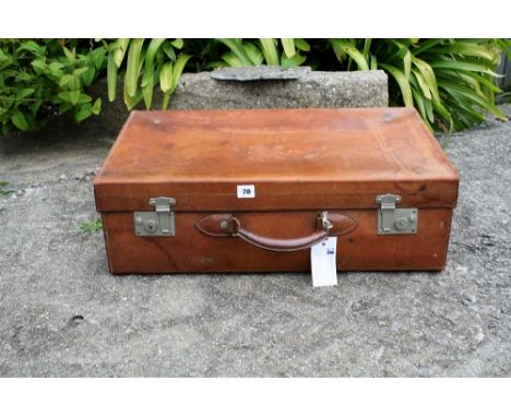 A vintage brown leather travelling suitcase.* Please Note: A further 500 lots from this sale (which are not available for liv