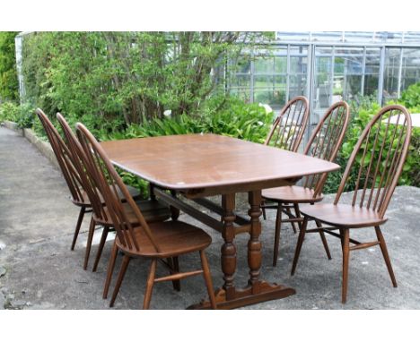 A Ercol dark elm refrectory table & six Quaker style chairs (7).* Please Note: A further 500 lots from this sale (which are n