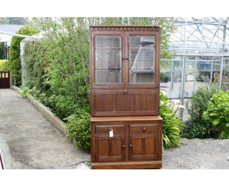 A Ercol Mural country style dresser in dark elm.* Please Note: A further 500 lots from this sale (which are not available for