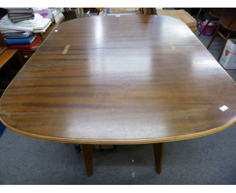 A vintage Morris of Glasgow dining table with hinged and swivel top, standing on four splayed tapering legs.* Please Note: A 