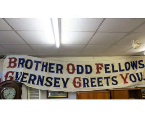 A vintage Oddfellows Loyal Guernsey Lodge handpainted street banner 1932, with original brown paper post packaging, dated 193