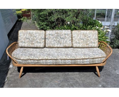 A vintage Ercol Day bed with original cushions.* Please Note: A further 500 lots from this sale (which are not available for 