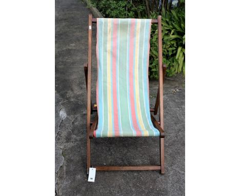 A vintage deck chair with a spare replacement cover.* Please Note: A further 500 lots from this sale (which are not available