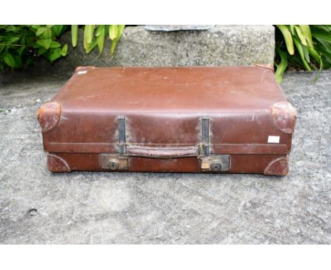 A vintage 'Revelation' leather suitcase.* Please Note: A further 500 lots from this sale (which are not available for live bi