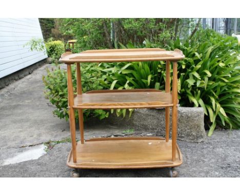 A vintage Ercol Windsor three tier hostess tea trolley.* Please Note: A further 500 lots from this sale (which are not availa