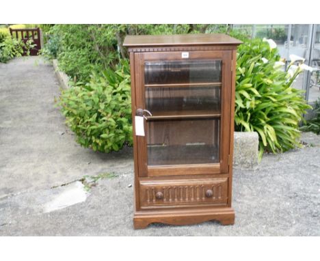 A Ercol dark elm Hi-Fi/media cabinet.* Please Note: A further 500 lots from this sale (which are not available for live biddi