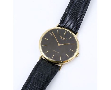 Herrenarmbanduhr "Chopard Automatic". Rundes 750/000 GG-Gehäuse. Schwarzes Zifferblatt mit goldenen Strichindizes. Automatikw