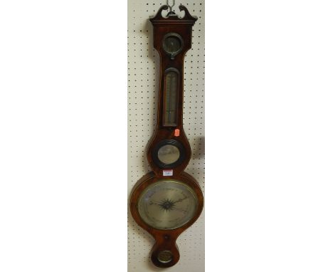 An early 19th century mahogany, satinwood and ebony strung four-dial wheel barometer