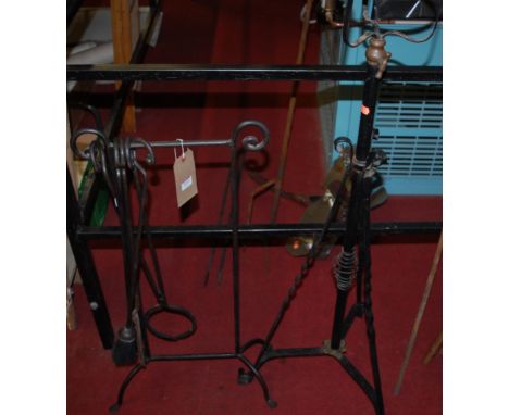 An Edwardian black painted wrought iron telescopic paraffin stand; together with a contemporary wrought iron fire stand with 