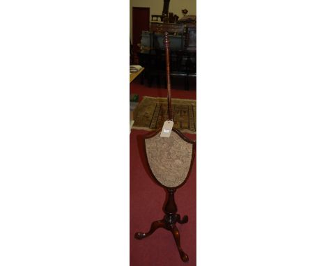 A 19th century mahogany and tapestry inset shield shaped pedestal pole screen 