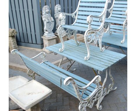 A painted cast metal ended and teak slatted rectangular garden table, together with matching two-seater garden bench, and sin