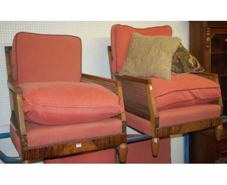 An Art Deco walnut and rosewood inlaid three piece canework bergère suite, having two-seater sofa, and a pair of armchairs, w