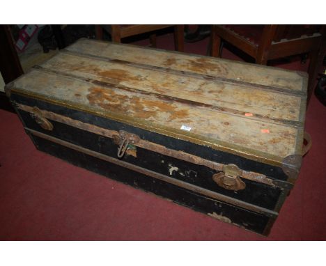 A pine, canvas, and metal bound hinge-top travelling trunk of long proportions, w.120cm 