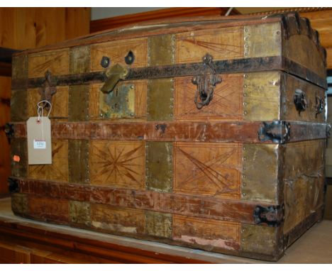 A canvas, wood and metal bound dome-top travelling trunk 