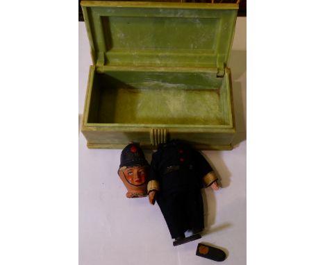 Composite headed Policeman dated 1926 to helmet in a bakelite jewellery box, 19 x 12 cm. P&amp;P Group 2 (£18+VAT for the fir