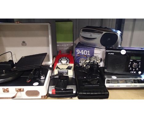 Mixed electrical lot including briefcase record player, solar panel, cassette players, cassette radios, with cables and power