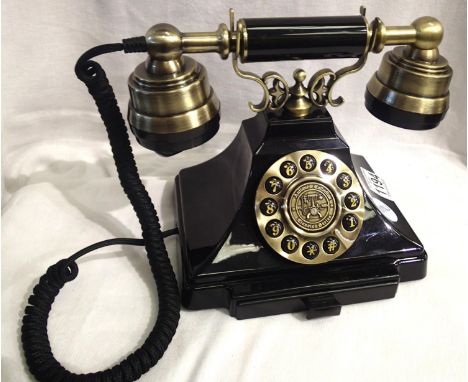 The Duke is a 1920s style push button telephone with a black &amp; brass finish and traditional cloth handset curly cord. Com