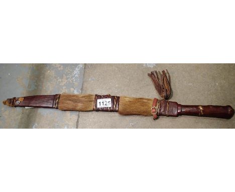 African knife in fur and leather sheath. P&amp;P Group 2 (£18+VAT for the first lot and £3+VAT for subsequent lots) 