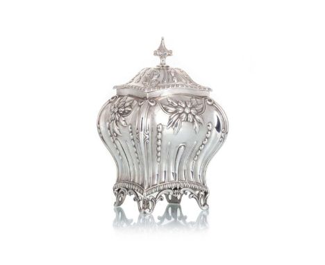 VICTORIAN SILVER TEA CADDY, HAWKSWORTH, EYRE & CO. LTD., LONDON 1900 of square bombe form, embossed with flowerheads, scrolls