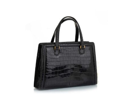 HERMÉS,  PULLMAN HANDBAG, PARIS, CIRCA 1960/70s  in black crocodile skin leather with brass hardware, stamped HERMÉS PARIS to