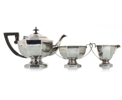 GEORGE V THREE PIECE ART DECO SILVER TEA SERVICE, WALKER AND HALL, SHEFFIELD 1919 of octagonal form, on spreading footed base
